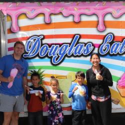 family enjoying food truck